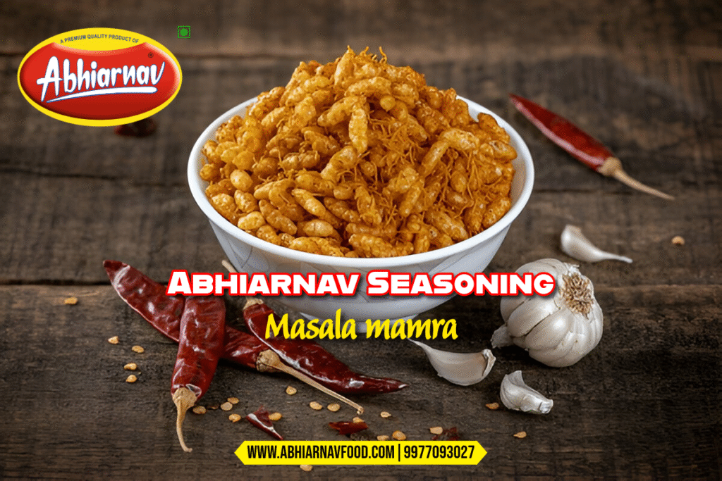 Bowl of spicy masala mamra made with Abhiarnav seasoning, surrounded by red chillies and garlic on rustic wooden background