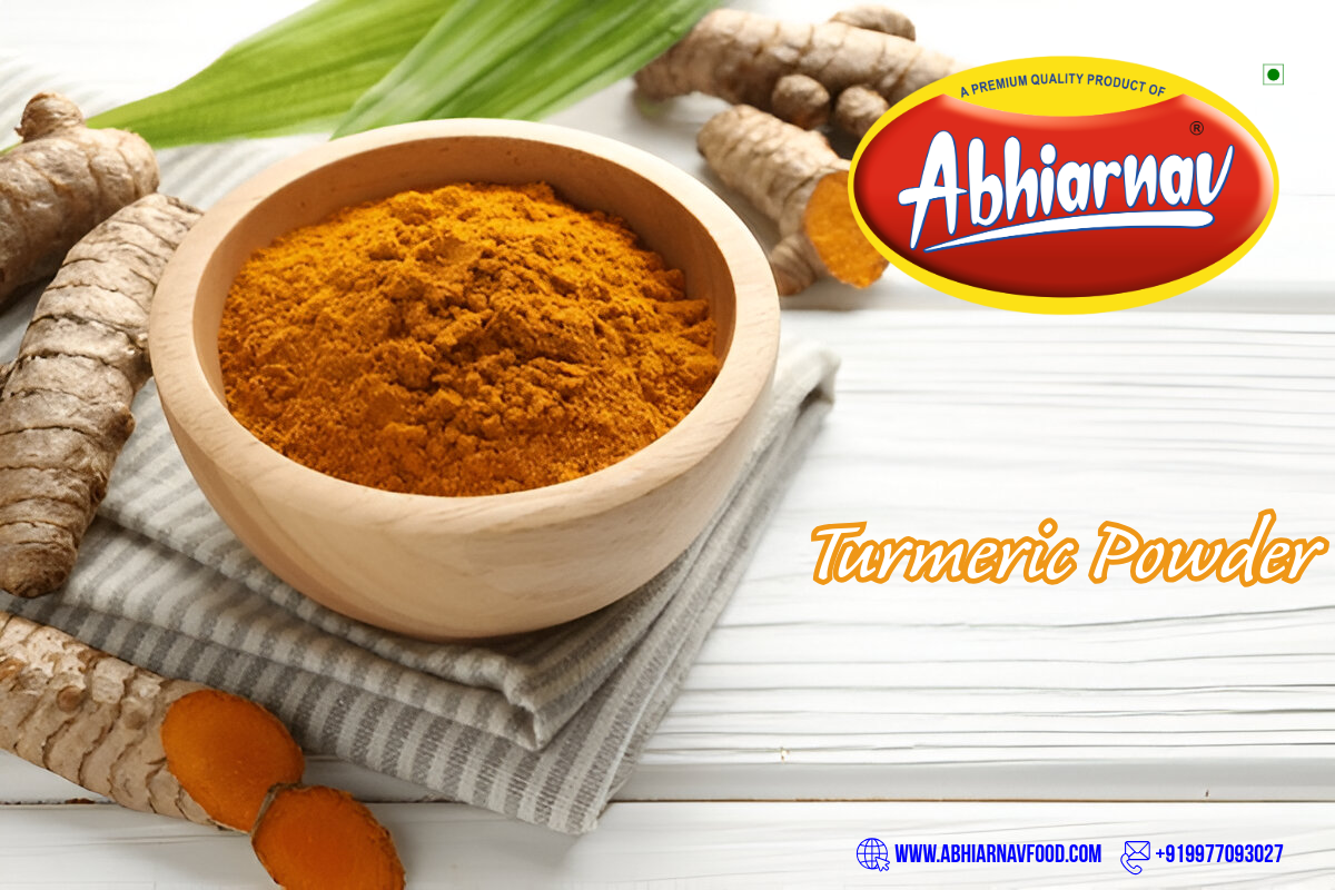 Abhiarnav Food Products premium turmeric powder in wooden bowl with fresh turmeric roots on white background.